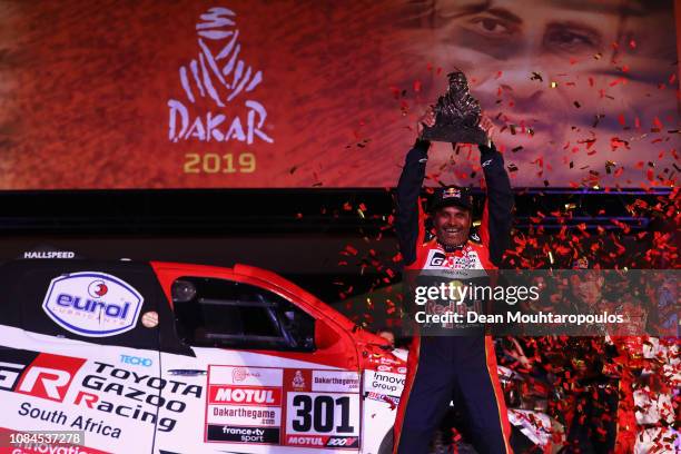 Toyota Gazoo Racing Sa no. 301 TOYOTA HILUX car driven by Nasser Al-Attiyah of Qatar celebrates victory and their 1st place on the podium after Stage...