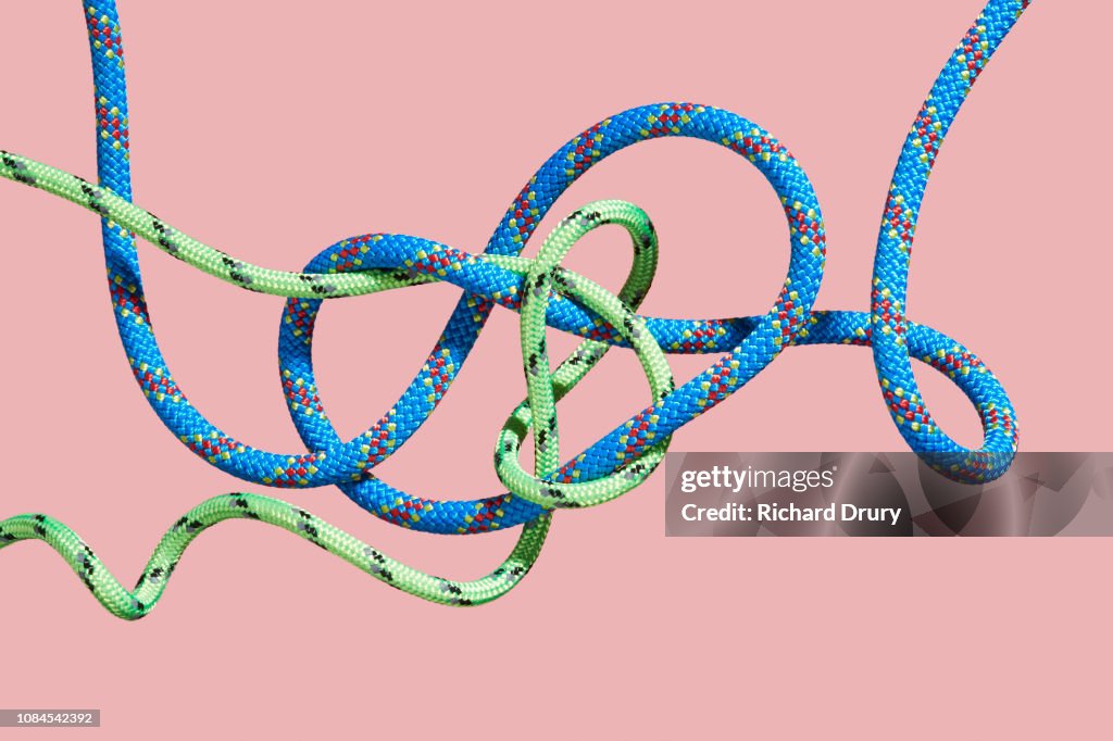 Two coloured ropes knotting together