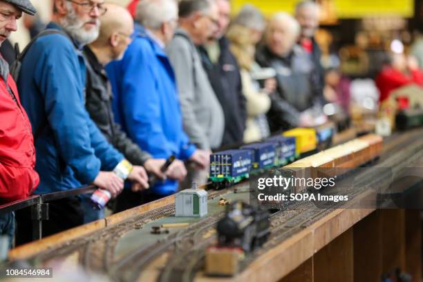 Enthusiasts and hobbyists are seen viewing steam locomotives at the annual London Model Engineering Exhibition at Alexandra Palace, north London....