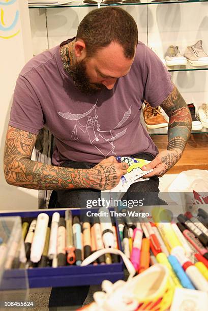 Artist JK5 creates at the GQ & Saks Signature Style event hosted by GQ Style Editor Adam Rapoport at Saks Fifth Avenue on October 1, 2009 in New York...