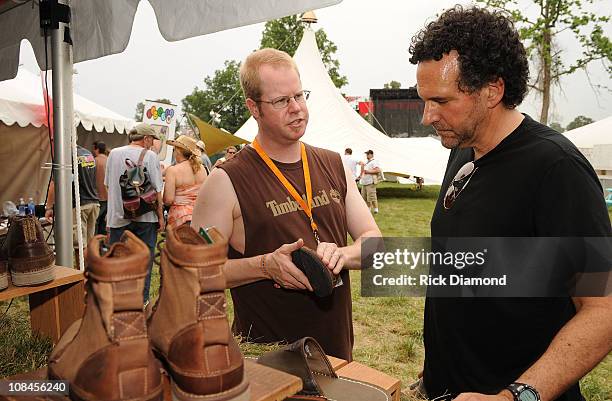 Brian Coleman of Timberland shows Harmonica player Mickey Raphael the summer must-haves and about the brand's Earthkeeper Network on June 13, 2008 at...