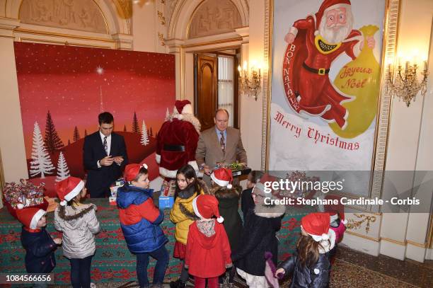 Louis Ducruet and Prince Albert II of Monaco attend the Christmas Gifts Distribution on December 19, 2018 in Monte-Carlo, Monaco.