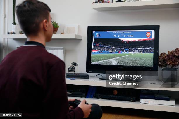 In this photo illustration a gamer plays the video game ‘FIFA 19' developed and published by Electronic Arts on a Sony PlayStation game console PS4...