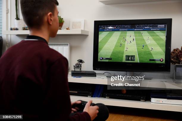 In this photo illustration a gamer plays the video game ‘FIFA 19' developed and published by Electronic Arts on a Sony PlayStation game console PS4...