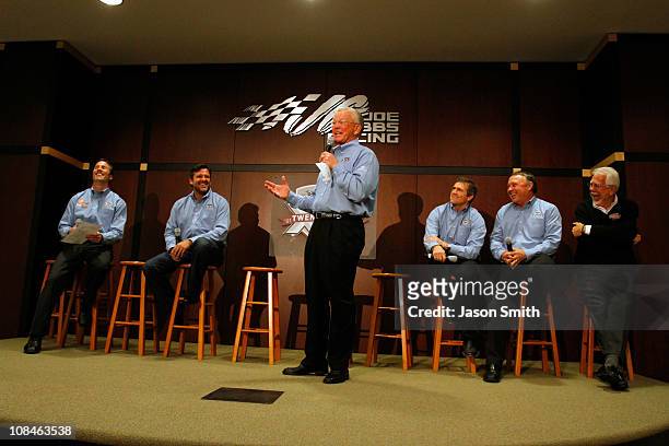 Team owner Joe Gibbs speaks, as JGR President J.D. Gibbs, driver Tony Stewart, driver Bobby Labonte, JGR senior vice president of racing operations...