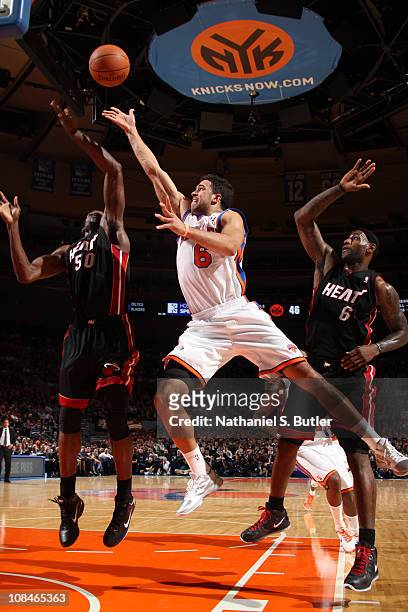 Landry Fields of the New York Knicks shoots against Joel Anthony of the Miami Heat during a game on January 27, 2011 at Madison Square Garden in New...