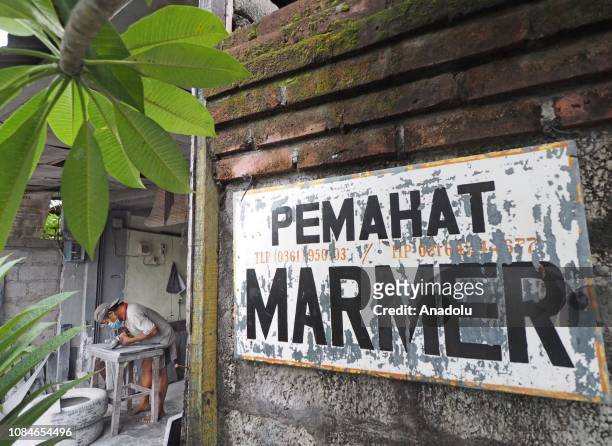 Workers sculpted inscriptions made of marble, in Bali, Indonesia on January 18, 2019. Writing on stone inscriptions is widely used to record a...