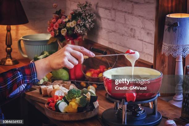 delicious swiss cheese fondue in a pot served with bread - cheese fondue stock pictures, royalty-free photos & images