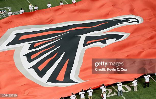 Giant flag with the Atlanta Falcons logo is seen on the field against the Green Bay Packers during their 2011 NFC divisional playoff game at Georgia...