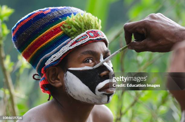 Western Highlanders preparing for a Sing-sing at the Paiya Show in the Western Highlands near Mt Hagen, Papua New Guinea.
