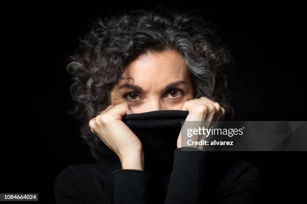 mature woman feeling cold - hid face stock pictures, royalty-free photos & images