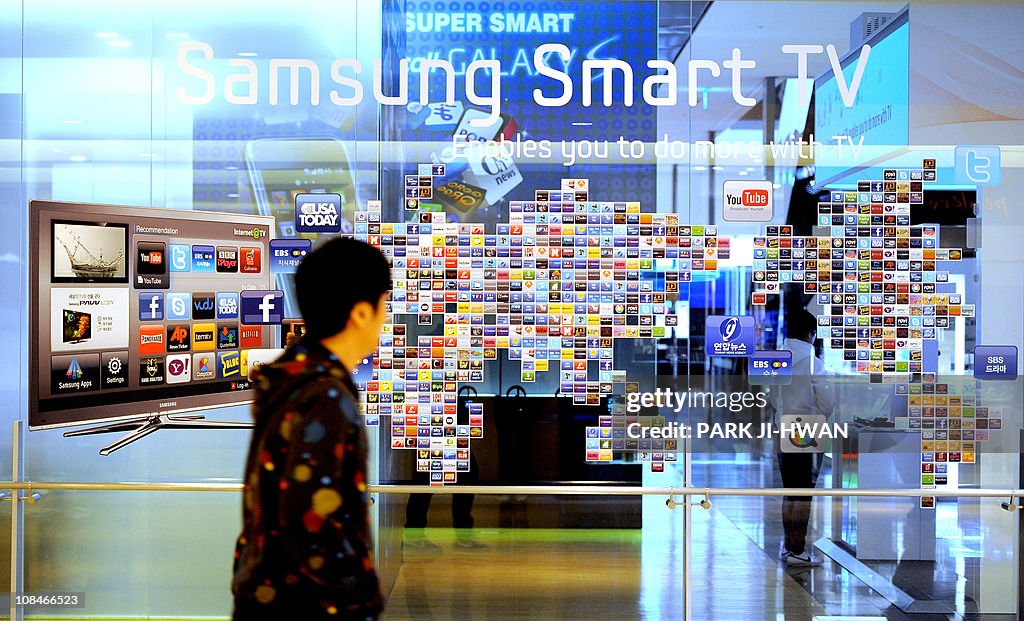 A South Korean man walks past a Samsung