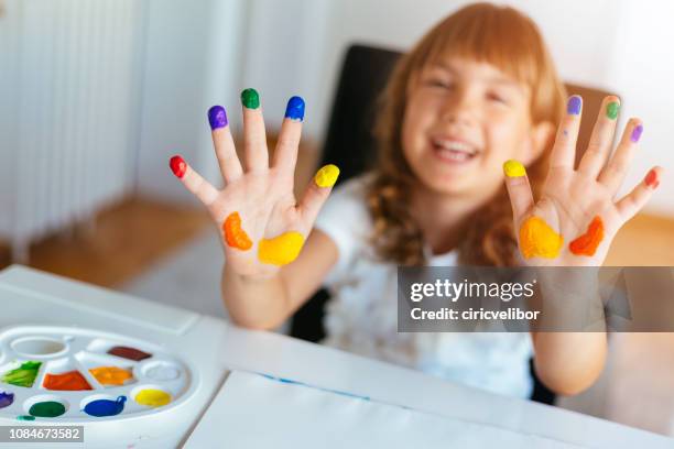 tjej visar färgglada målade händer - 4 girls finger painting bildbanksfoton och bilder