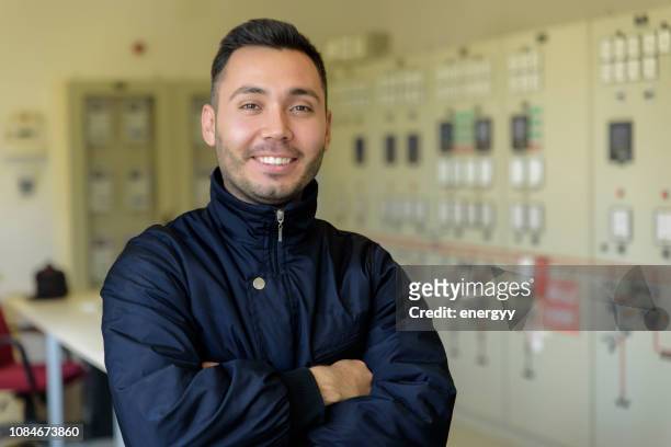 man in front of control panel - nuclear energy worker stock pictures, royalty-free photos & images