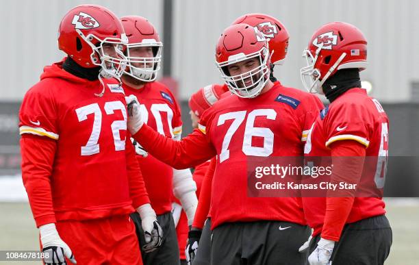 Kansas City Chiefs offensive guard Laurent Duvernay-Tardif jokes with offensive tackle Eric Fisher during Friday's practice on Jan. 18, 2019 ahead of...