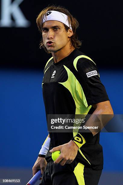 David Ferrer of Spain preacts in his semifinal match against Andy Murray of Great Britain during day twelve of the 2011 Australian Open at Melbourne...