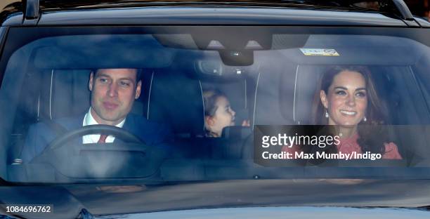 Prince William, Duke of Cambridge, Catherine, Duchess of Cambridge and Princess Charlotte of Cambridge attend a Christmas lunch for members of the...