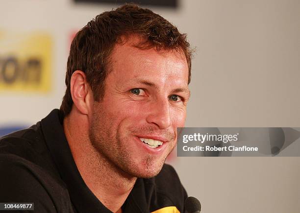 Australian captain Lucas Neill talks to the media during an offical pre-match media conference at Khalifa Stadium on January 28, 2011 in Doha, Qatar.