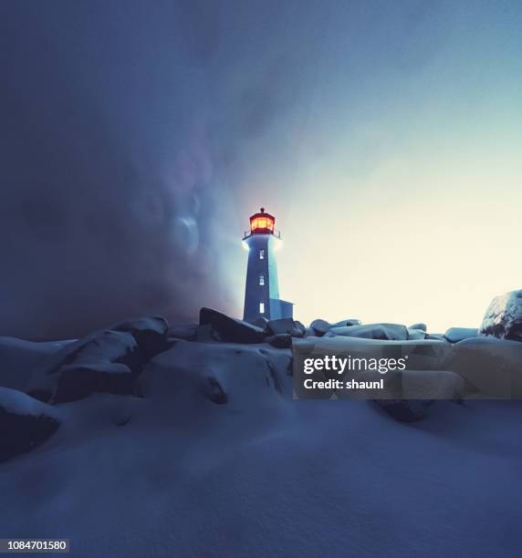 blizzard at peggy's cove lighthouse - frozen and blurred motion stock pictures, royalty-free photos & images