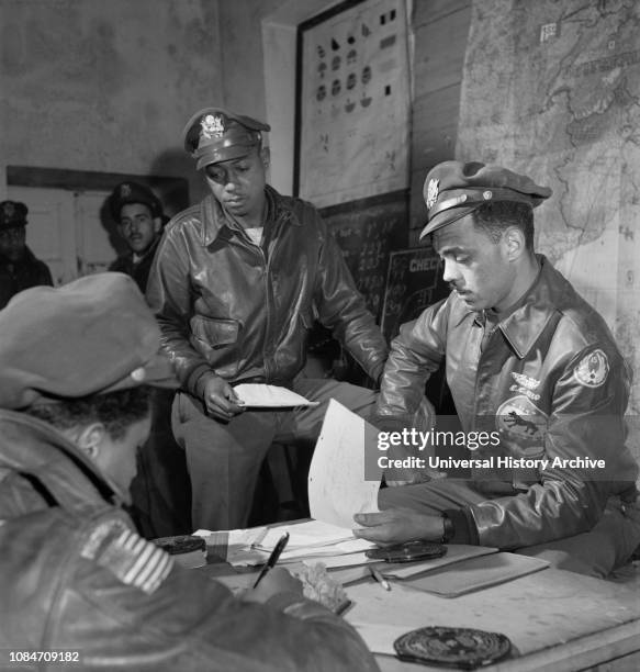 Tuskegee Airmen attending Briefing at Air Base, Woodrow W Crockett, Edward C Gleed, Toni Frissell, March 1945.