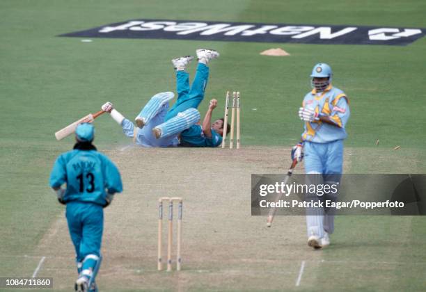 Robin Singh of India is run out by Chris Cairns of New Zealand during the World Cup Super Six match between India and New Zealand at Trent Bridge,...