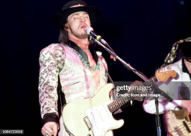 American musician and lead singer Stevie Ray Vaughan of the group Stevie Ray Vaughan and Double Trouble, plays on stage during the Soul to Soul Tour...