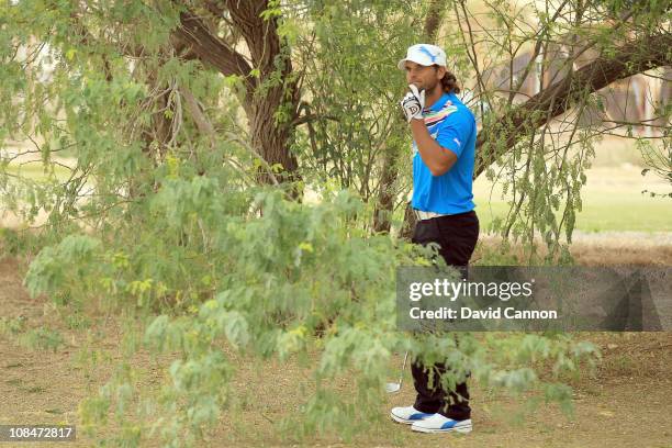 Johan Edfors of Sweden in trouble in trees for his third shot at the 15th hole during the second round of the 2011 Volvo Champions held at the Royal...