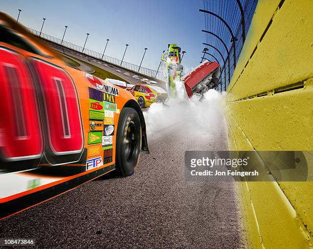 car accident at racetrack - nascar stock pictures, royalty-free photos & images