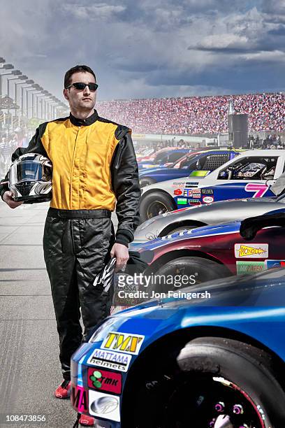 portrait of race car driver at track - pilota di auto da corsa foto e immagini stock