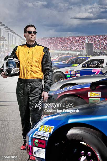 portrait of race car driver at track - car racing helmet stock pictures, royalty-free photos & images