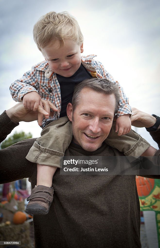 Father and son at the pumpkin patch