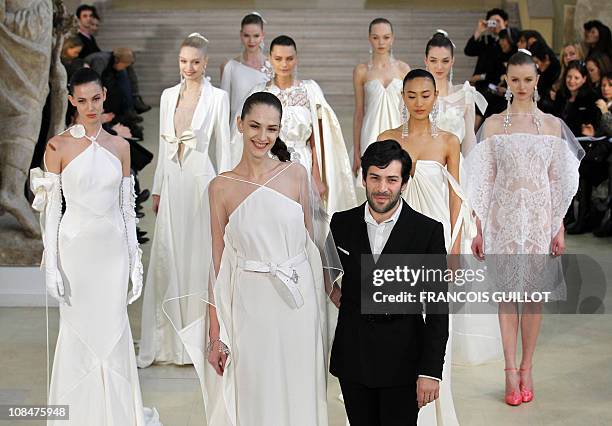 French designer Alexis Mabille acknowledges the audience after presenting the Spring-Summer 2011 Haute Couture Collection Show on January 24 in...