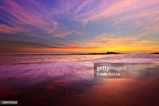 color splash at sunset, laguna beach - laguna beach californië stockfoto's en -beelden