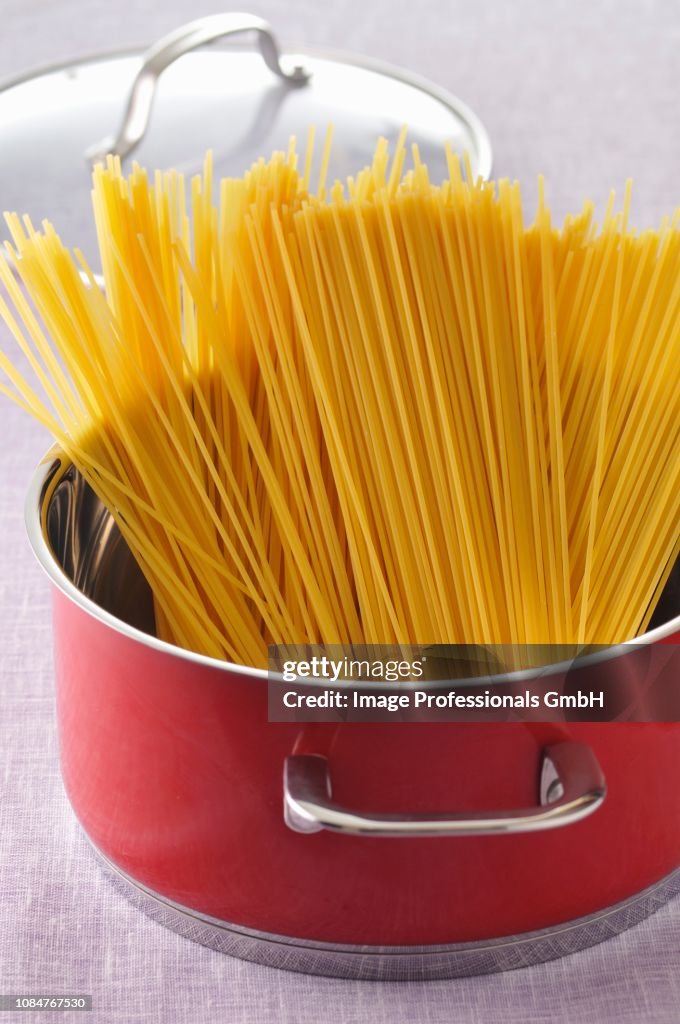 Uncooked spaghetti in a cooking pot