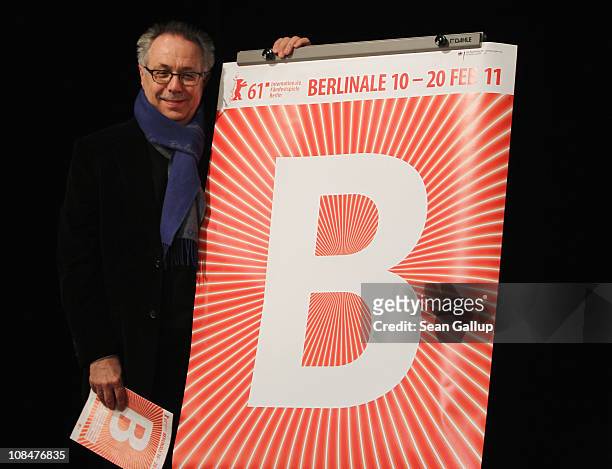 Dieter Kosslick, Director of the Berlinale International Film Festival, stands next to the 61st official Berlianle poster after speaking to the...