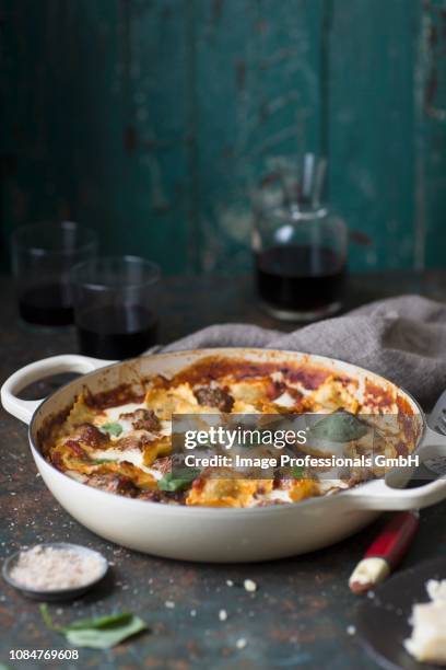 ravioli bake with meatballs and basil - noodle casserole stock pictures, royalty-free photos & images