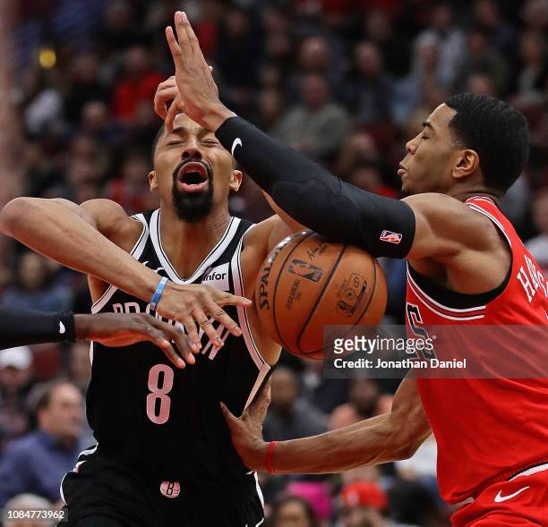 Spencer Dinwiddie of the Brooklyn Nets is fouled by Shaquille Harrison of the Chicago Bulls at the United Center on December 19, 2018 in Chicago,...