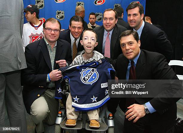 Derek MaGuire, Mike Pendy, Peter Ramsey, James Olsen and Pat LaFontaine, President of Companions in Courage, pose for a photo with 16-year old...