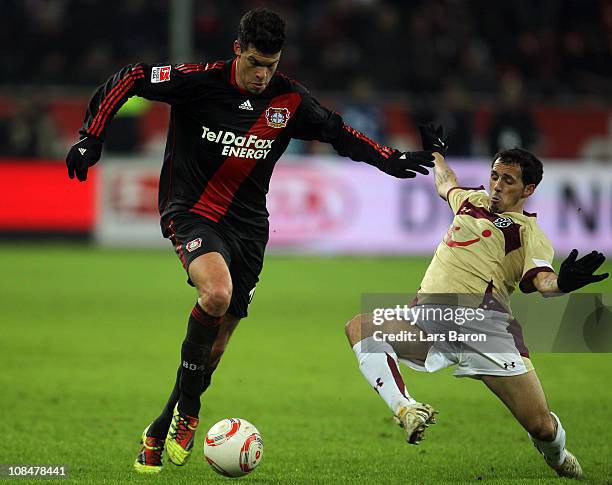Michael Ballack of Leverkusen is challenged by Sergio Pinto of Hannover during the Bundesliga match between Bayer Leverkusen and Hannover 96 at...