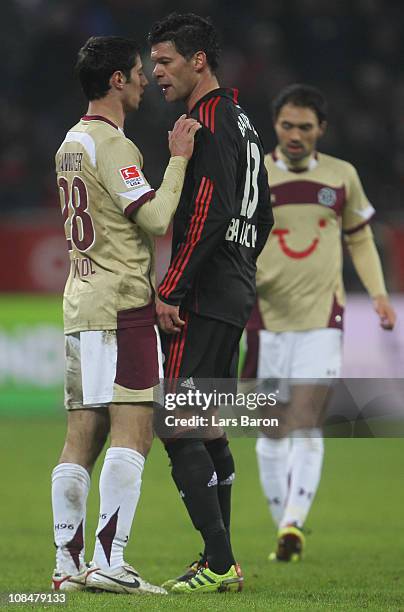 Lars Stindl of Hannover discusses with Michael Ballack of Leverkusen during the Bundesliga match between Bayer Leverkusen and Hannover 96 at BayArena...