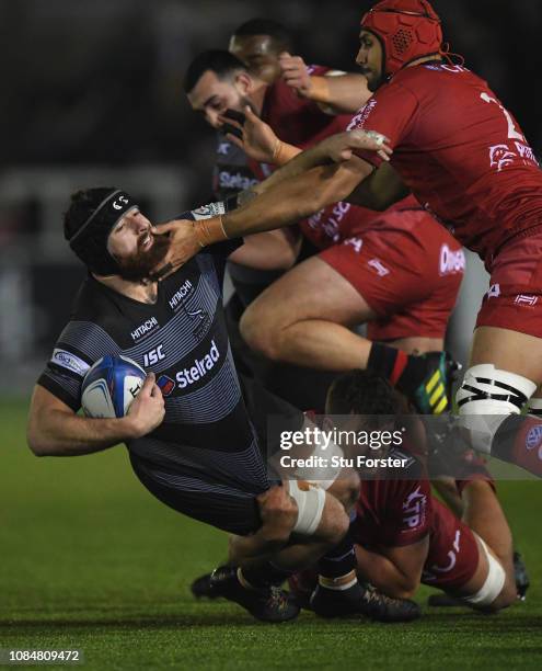 Falcons player Gary Graham is tackled by the Toulon defence during the Champions Cup match between Newcastle Falcons and Toulon at Kingston Park on...