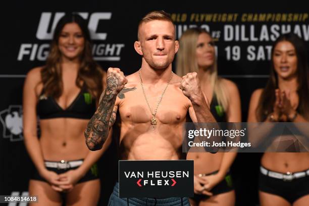 Dillashaw poses on the scale during the UFC Fight Night weigh-in at Barclays Center on January 18, 2019 in the Brooklyn borough of New York City.