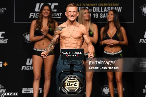 Dillashaw poses on the scale during the UFC Fight Night weigh-in at Barclays Center on January 18, 2019 in the Brooklyn borough of New York City.