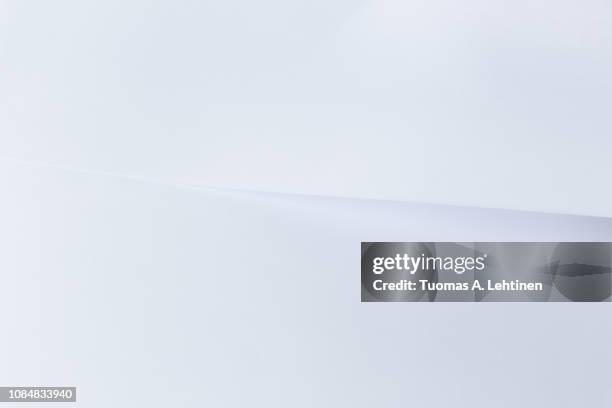 clean white sheet of paper overlayed with another white paper. very simple and minimal abstract background. - backdrop photos et images de collection