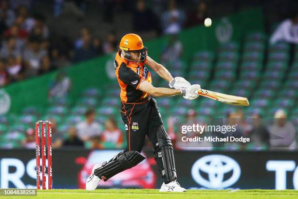 Ashton Turner of the Scorchers scores a six after the ball hit the roof during the Big Bash League match between the Melbourne Renegades and the...