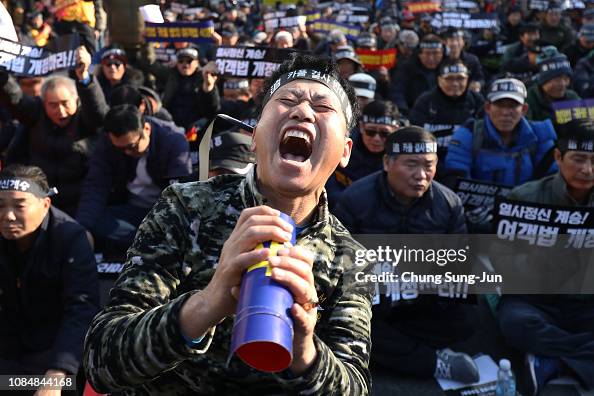 South Korean taxi drivers participate in a rally calling for the ...
