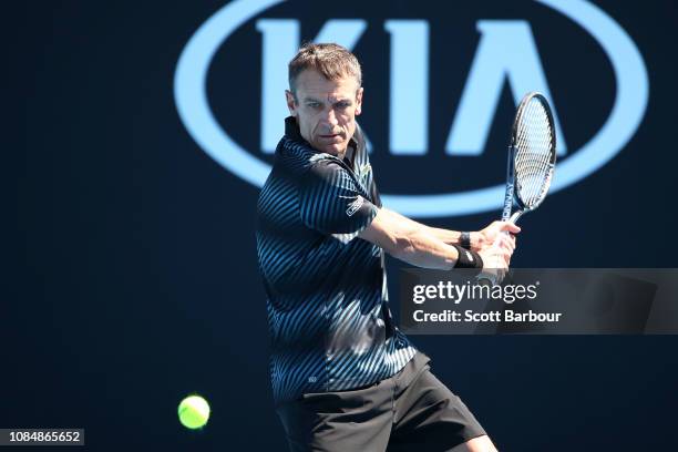 Mats Wilander of Sweden plays a backhand in his Men's Legends Doubles with Thomas Enqvist against Mansour Bahrami of Iran and Mark Philippoussis of...