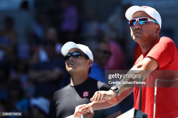 Michael Chang watches the third round match between Kei Nishikori of Japan and Joao Sousa of Portugal during day six of the 2019 Australian Open at...