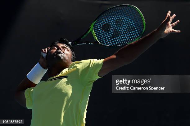 Leander Paes of India serves in his Mixed Doubles match with Samantha Stosur of Australia against Kveta Peschke and Wesley Koolhof during day six of...