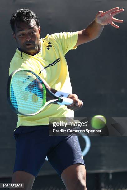 Leander Paes of India plays a forehand in his Mixed Doubles match with Samantha Stosur of Australia against Kveta Peschke and Wesley Koolhof during...